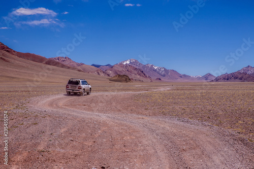 4WD car making its way along a deserted side road of the Pamir highway in Tajikistan