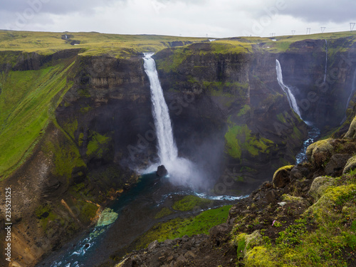 Valley of river Fossa with Beautiful Haifoss waterfall in South Iceland, summer moody sky