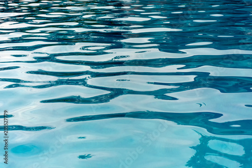 Patterns and ripples of swimming pool water surface