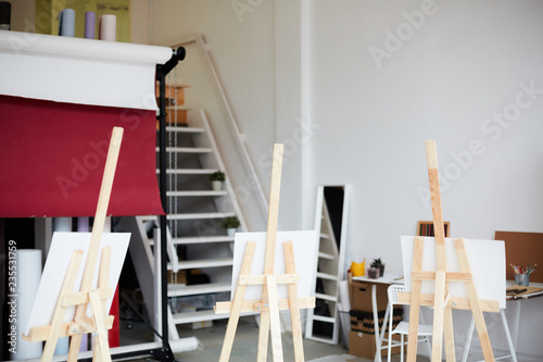 Group of easels in contemporary art studio or classroom in school of arts
