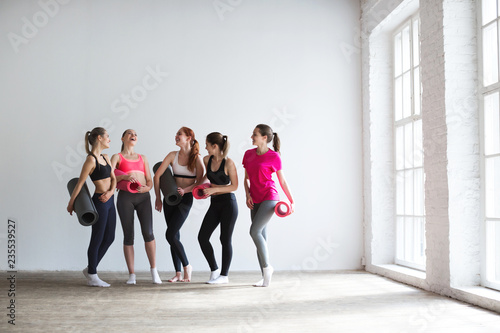 Happy group of fit women at the gym.