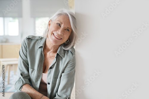  Beautiful relaxed elderly woman sitting at home