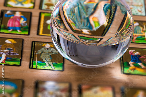 Fortune teller Crystal ball and in transparency tarot cards background .