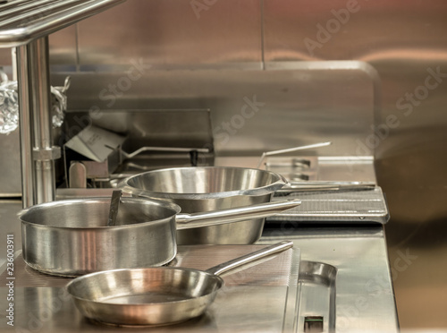 Modern stainless steel hobs in commercial kitchen