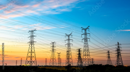 high-voltage power lines at sunset,high voltage electric transmission tower