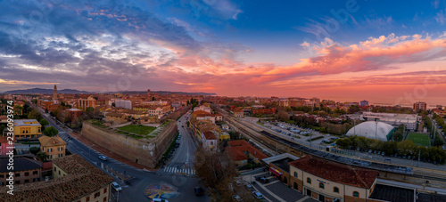 Aerial panorama of popular travel destination beach town Fano in Italy with sunset blue, red, purple sky near Rimini in the Marche region.