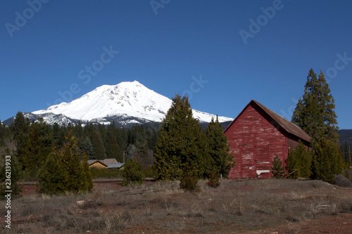 Mt. Shasta in California behind a red barn