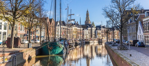 Panorama of historic ships and warehouses in the center of Groningen, The Netherlands