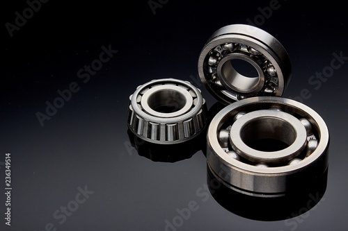 Close-up of a set of ball and roller bearings on a dark background