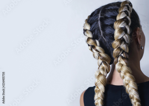 two thick braids of artificial hair, a youth hairdo, colored hai