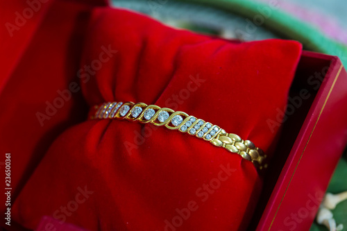 Bride price, gold and Diamond bracelet on deluke plate in Thai wedding ceremony. traditional wedding ceremony. image for background, wallpaper, objects, article, illustration and copy space.