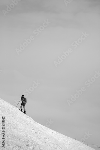 Skier before downhill on snowy freeriding slope