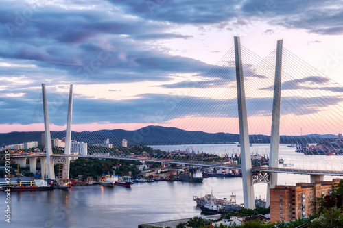 Golden bridge and Golden Horn bay at sunset, Vladivostok, Russia