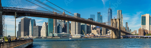 Iconic view of Brooklyn bridge over Manhatten skyscrapers in New York.