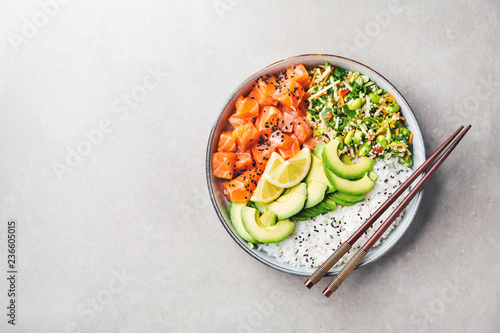 Poke bowl with salmon served in bowl