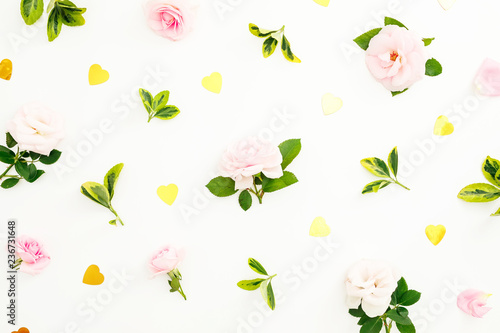 Valentines day composition with roses flowers, leaves and golden confetti on white background. Flat lay, top view.