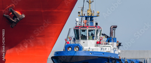 TUGBOAT AND SHIP - Ships maneuver in the port