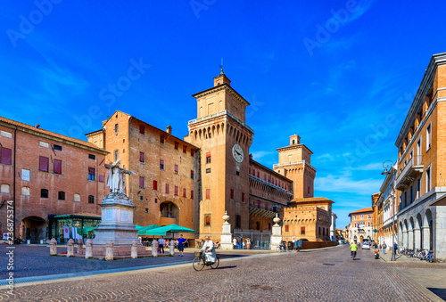 Castle Estense (Castello Estense) and piazza Savonarola and monumet to Savonarola in Ferrara, Emilia-Romagna, Italy. Ferrara is capital of the Province of Ferrara