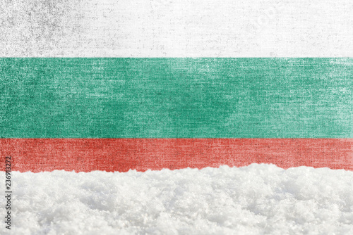 Winter grunge background with snowdrift and Bulgarian flag in the backdrop