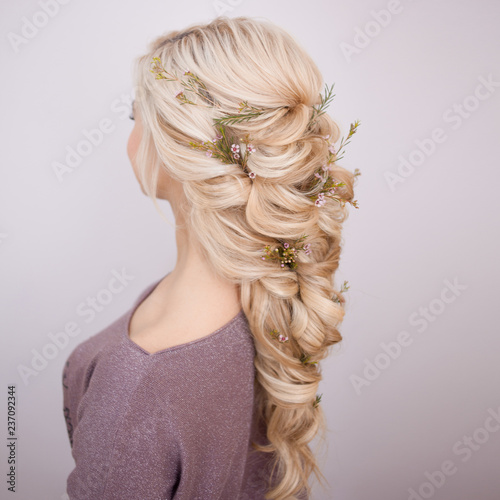 hairstyles with weaving strands decorated with small flowers.