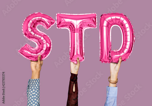 Hands holding STD word in balloon letters