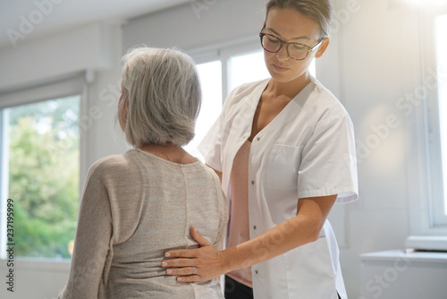 Senior woman with her physiotherapist