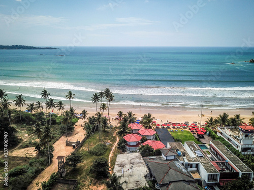 Ocean beach with palm trees, Weligama, Sri Lanka, aerial view