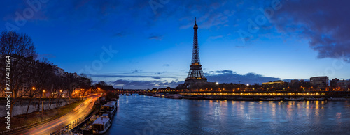 Eiffel Tower and Seine River banks in early morning light. Panoramic view in Paris, France