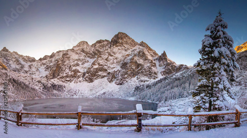 Winter mountains with icy lake Sea Eye in Tatra national park. Morskie oko landscape