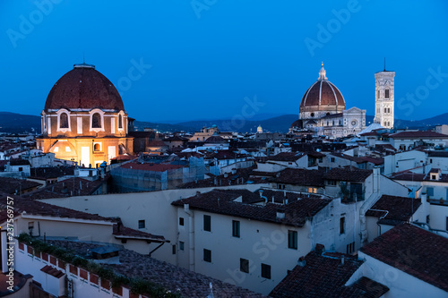 Cityscape, skyline aerial view of Firenze, Italy, at night, twilight, dusk, houses rooftops, illuminated Florence Cathedral, Cattedrale di Santa Maria del Fiore, Medici Chapels, San Lorenzo church