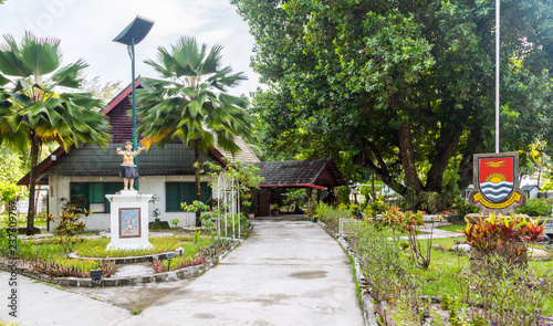 President's residence, Government building with a monument, republic Coat of arms and Motto "Te Mauri, Te Raoi ao Te Tabomoa", South Tarawa, Kiribati