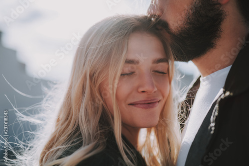 Beautiful young lady enjoying company of her boyfriend