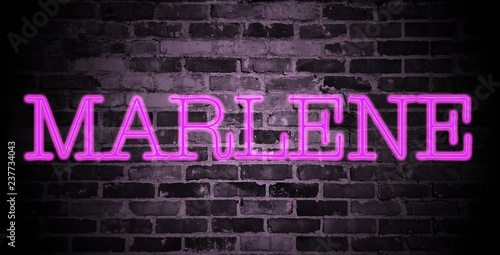first name Marlene in pink neon on brick wall