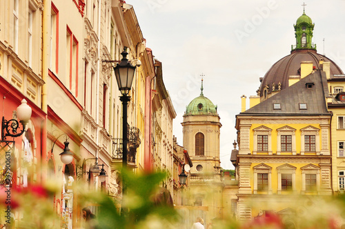 Exterior of old ornamental architectural buildings of Lviv city with lanterns on street, Ukraine. Beautiful architecture of Lviv city