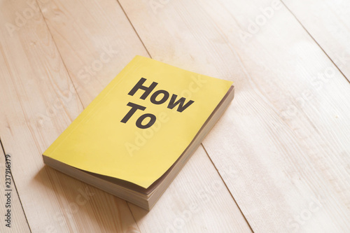 How to book or guidebook on wooden table