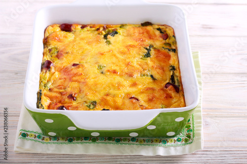 Savoy cabbage, sausages and cheese gratin