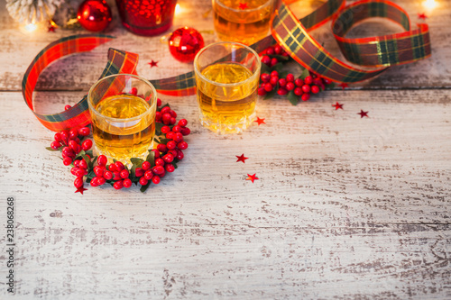 Whiskey, brandy or liquor shot and Christmas decorations