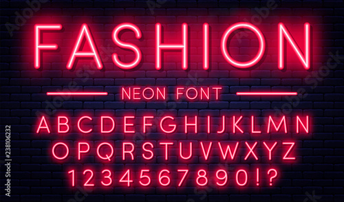 Neon alphabet with numbers. Red neon style font, fluorescent lamps on brick wall background