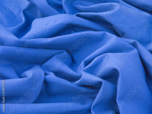 folds of blue cotton gabardine, abstract background