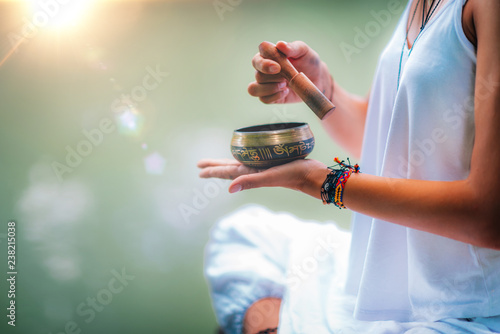 Young woman with Tibetan Singing Bowl