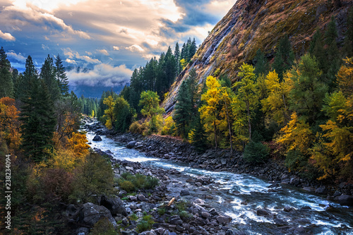 Amazing clouds and fall colors in autumn on the Icicle River in North Central Washington