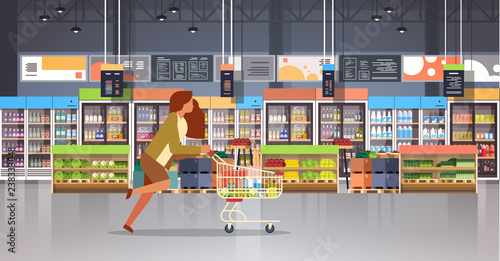 running business woman customer with shopping trolley cart busy female shopper buying products grocery market interior flat horizontal