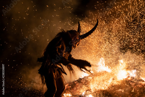 The Krampus masks in an exhibition in the night in Tarvisio, Italy