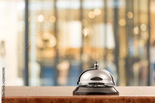 Vintage hotel reception service desk bell on