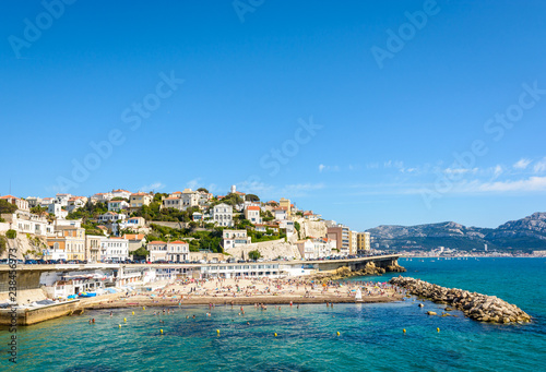 General view of the Prophet beach in Marseille, France, a very popular family beach located on the Kennedy corniche, on a hot and sunny spring day.