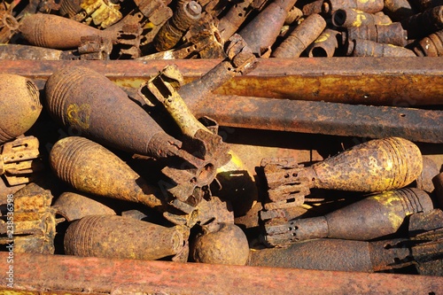 Pile of rusty unexploded ordnance recovered and disarmed in rural Laos