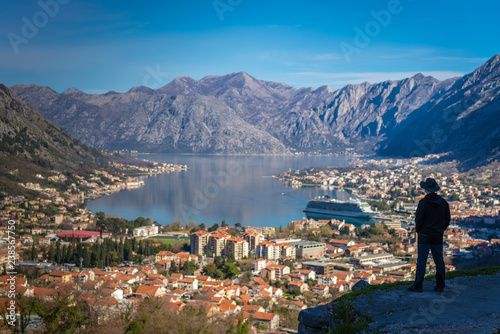 Tourist admiring Kotor town and Bay from above