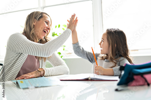 A Mother and Child doing homework at home