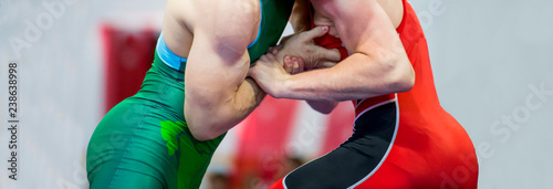 Two wrestlers Greco-Roman wrestling during competition