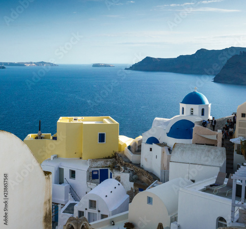White architecture and blue dome churches in Oia; Santorini island; Greece